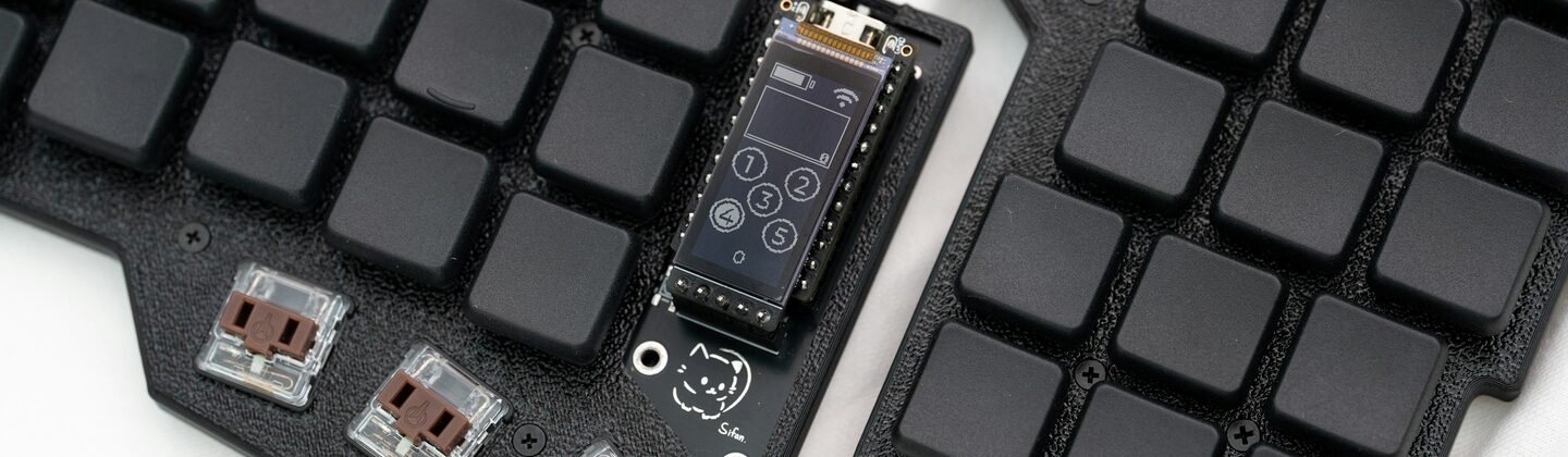 A computer keyboard with several components attached to it
